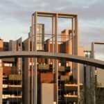 Modern residential architecture with geometric frames and bridge design in urban housing complex