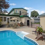 Modern residential house with swimming pool and outdoor patio design