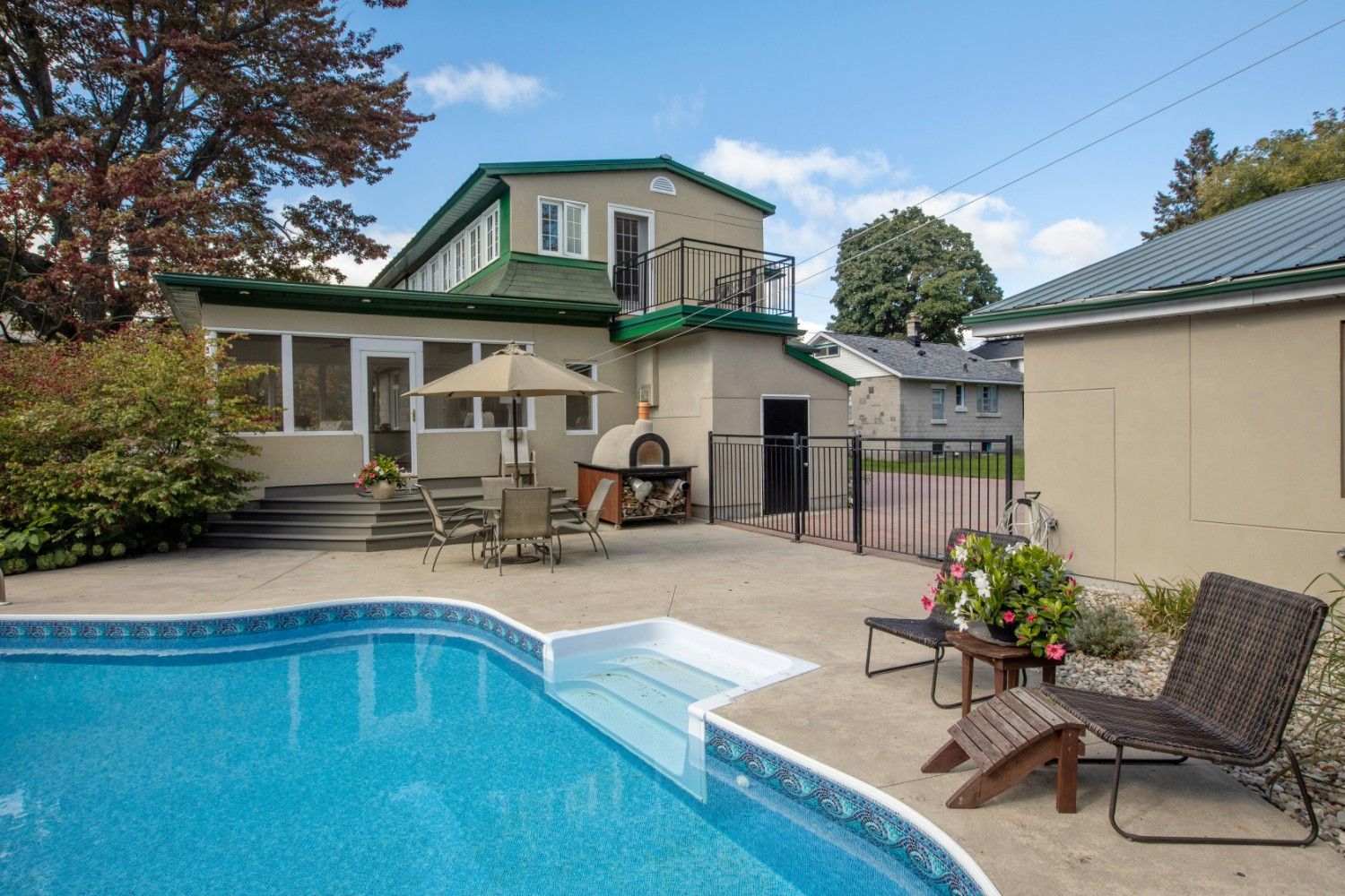 Modern residential house with swimming pool and outdoor patio design